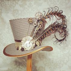 Brown tweed mini top hat, percher hat, decorated with cogs and gears and pheasant feathers. Steampunk hat, Millinery, Country style, rustic. by OohLaLaBoudoir on Etsy https://www.etsy.com/listing/659546536/brown-tweed-mini-top-hat-percher-hat Cogs And Gears, Steampunk Elements, Hat Feathers, Midi Top, Steampunk Hairstyles, Mad Hat, Steampunk Top Hat, Mad Hatter Hat, Steampunk Hat