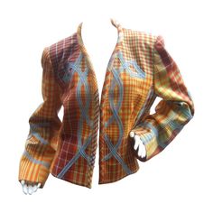 Christian Lacroix Paris Plaid wool jacket Size 46 c 1990s The unique high fashion jacket is designed with bold plaid colors; embellished with pale blue contrasting applique on the front exterior that extends to the sleeves The collar & front opening of the designer jacket have a rolled border that runs to the hem. In the true spirit of Lacroix the chic jacket is lined in contrasting striped fabric. The jacket secures with hook & eye interior closures is designed without buttons or pocket Jacket Without Sleeves, Jean Muir, Best Of Fashion Week, Chic Jacket, Designer Jacket, Archive Fashion, Striped Fabric, Christian Lacroix, Jacket Design