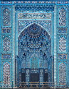 the entrance to an ornate blue building