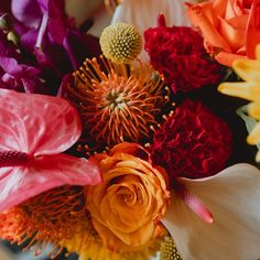 a bunch of flowers that are sitting on a table