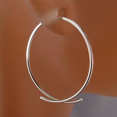 Handmade Stylized Oval Hoops by Cecile Stewart Jewelry -choose from a variety of metals that are all hypoallergenic and nickel free -metal choices are sterling silver, low tarnish argentium sterling, 14kt yellow gf, 14kt rose gf, grey niobium -earrings made to your size desire -select size in drop down menu -choose from 1 inch to 2 1/2 inches -fits standard piercings -nickel free -pair -lightweight -twist to the side to open -photos are on a mannequin and are of 1 inch earrings These earrings ar Minimalist Hoop Jewelry As Gift, Minimalist Hoop Jewelry Gift, Modern Hoop Earrings With Simple Design, Simple Sterling Silver Hoop Jewelry, Minimalist Polished Hoop Earrings, Minimalist Sterling Silver Hoop Jewelry, Minimalist Hypoallergenic Hoop Earrings For Anniversary, Minimalist Hoop Metal Jewelry, Simple Hoop Jewelry As Gift