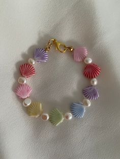 Summer is a state of mind and you can bring it with you anytime you wish with this bracelet!  Made with natural freshwater pearls and acrylic shell beads, this composition will make the person who wear it, very happy. You can choose between a bracelet or an anklet. Standard length for bracelet is 17 cm Standard length for anklet is 23cm In both cases, if you need a different size, just leave me a message! Thanks for stopping by and don't forget to check my shop for more unconventional jewelry  Have a wonderful day  Veronica Trendy Shell-shaped Jewelry Gift, Summer Pearl Bracelet With Pearl Charm As Gift, Summer Gift Pearl Bracelet With Pearl Charm, Trendy Pastel Jewelry For The Beach, Shell Bracelets As Summer Gifts, Summer Shell Bracelets For Gifts, Summer Shell Bracelets Perfect As Gifts, Shell Strand Bracelets As Gift, Summer Pearl Charm Bracelets As Gifts