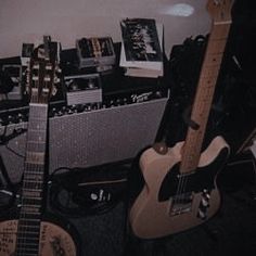 guitars and amps lined up in a room