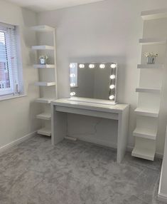 a white desk with lights on it in a room