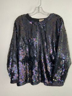 "Black jacket, made from real sequins, pure silk, rayon, party jacket, free form jacket, mid jacket, streetstyle jacket, vintage style, cinema clothing, movie clothing, show jacket, TV clothing, New Year clothing, cosplay, has size - extra large. Women's modern jacket; made from real silk; jacket strewn with sequins; also lining from rayon; middle length comfortable jacket - black color. Jacket has a free form; jacket fastened via frog closure; the lining is clean, without smell - black color. F Disco Style Winter Festival Outerwear, Winter Festival Disco Outerwear, Long Sleeve Outerwear For Party And Festival, Festive Long Sleeve Outerwear For Party Season, Spring Sequin Outerwear For Costume Party, Disco Style Long Sleeve Party Outerwear, Long Sleeve Outerwear For Costume Parties, Sequin Outerwear For Party Season And Festivals, Sequin Outerwear For Party And Festival