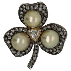 Metal: Silver & Gold Condition: Excellent Year Of Manufacture: Circa 1950s Gemstone: Diamond, Cultured Pearl Cut : Rose Total Diamond Weight: 3 CT Item Weight: 20.5 grams Length: 1.8 inches Petal Width: 0.79 inches Pearl Width: 0.48 inches Total Width: 1.6 inches SKU#PB-02561 Canadian Jewelry, Antique Brooches, Diamond Brooch, Silver Tops, Gold Brooches, Pearl Brooch, Silver Brooch, Jewelry Companies, Rose Cut Diamond