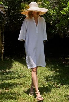 Eco friendly caftans and tunics inspired by the ocean, made on main street. Ethically sourced and locally made in Los Angeles. You asked, we delivered: A short version of our popular double gauze tunic dress. Simple, pared down, and easy, this is the ultimate 'throw-on-and-go' dress. Made in our soft, double gauze fabric, it drapes as beautifully as it launders. (It's hard to believe, but it gets softer and softer with each wash, and, it won't shrink). With pockets and a classic v neckline, this Daywear Relaxed Fit Tunic With Split Neck, Relaxed Fit Split Neck Tunic For Daywear, Summer Cotton Gauze Loungewear Dress, Summer Cotton Gauze Dress For Loungewear, Summer Cotton Gauze Lounge Dress, Relaxed Fit Tunic Dress Unlined, Spring Cotton Gauze Dresses For Loungewear, White Cotton Gauze Summer Dress, Spring Cotton Gauze Loungewear Dresses