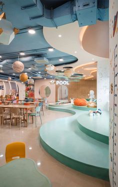 the interior of a children's playroom with colorful furniture