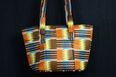 This African bag is huge! It will fit everything you need on a daily basis in it, no problem. Its colourful! Made from the best African prints we could find for the fun and funky look. You'll love this bag, we know it. We are a brand with a purpose! All our bags are handmade in Africa, by Africans, with the aim of providing full time and sustainable employment to local craftspeople.  Read our full story on www.conitnentclothing.com Beach Bag features - Large Volume - Zipper Closure  - 2 Inner Pockets - Reinforced Straps Dimensions - Height, 11in - Width, 16in - Depth, 11in Still Shopping? Check This! https://www.etsy.com/uk/shop/ContinentClo Large Multicolor Bags For Daily Use, Large Multicolor Casual Bag, Multicolor Square Shoulder Bag For Travel, Square Multicolor Travel Shoulder Bag, Large Multicolor Shopping Bag, Casual Multicolor Box Bag For Travel, Multicolor Everyday Tote Travel Bag, Multicolor Shoulder Travel Bag, Large Multicolor Shoulder Bag For Daily Use