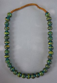 This ethnic necklace with green-yellow glass beads originates from Nepal. The hanging length of the strand is 33 cm. The average diameter of the beads is 1.6 cm. Its weight is 200 gram.(s03)SHIPPINGSHIPMENT is FREE.All items are shipped every week on monday morning after receipt of payment.We send priority airmails. Please consider overseas shipments take usually 5 - 8 days.Insured packets (over 50 cm length / over 1500 gram) I send by standard way.PAYMENTPaypal is preferred. RETURN POLICY:NO RI Tibetan Jewelry, Asian Jewelry, Ethnic Necklaces, Yellow Stripes, Lampwork Beads, Nepal, Green Glass, Blue Glass, Round Beads