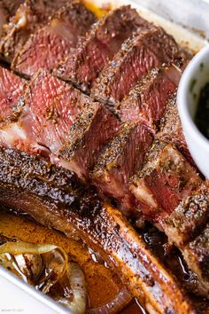 the steak is prepared and ready to be served in the oven with sauce on the side