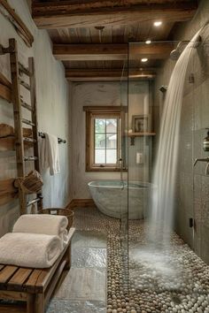 a bath room with a large tub and a stone floor