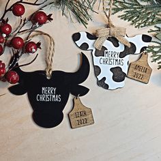 three christmas ornaments hanging from a tree