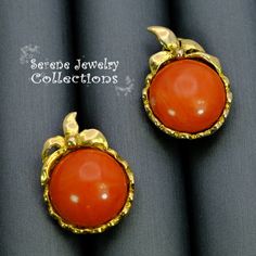 Beautiful 14k solid gold earrings with smooth red coral cabochons! They are a clip on style but also has a post. Length: 0.8 inch Total Weight: 10.8 grams Precious Metal: 14k gold Precious stones: -Coral Cabochon: 14.2mm Luxury Cabochon Clip-on Earrings For Formal Occasions, Formal Clip-on Earrings With Oval Cabochon, Luxury Formal Clip-on Earrings With Cabochon, Elegant Orange Clip-on Earrings, Gold Gemstone Clip-on Earrings For Formal Occasions, Formal Gold Gemstone Clip-on Earrings, Elegant Yellow Gold Clip-on Earrings With Cabochon, Formal Gold Clip-on Cabochons, Unique Gold Cabochon Earrings