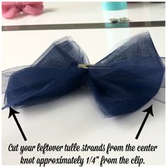 an image of a bow on a table with text above it that says, cut your leftover tie strands from the center knot approximately 11 feet from the clip