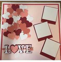 a valentine's day card with paper hearts and the word i love you on it