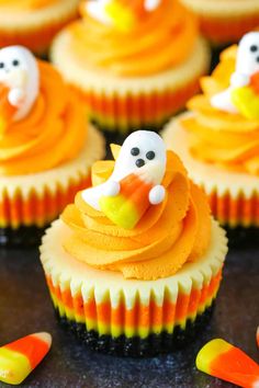 cupcakes decorated with icing and candy decorations