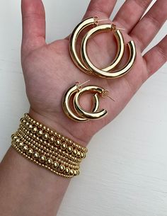 Metallic Stackables - Gold 4mm Gold 4mm Beaded Bracelets One size fits most. Elegant Gold Stackable Hoop Earrings, Gold Stackable Jewelry With Round Beads, Gold Hand-strung Bangle Jewelry, Gold Stackable Hoop Earrings, Gold Beaded Hoop Jewelry, Tarnish Resistant Hoop Gold Bracelets, Gold Tarnish Resistant Hoop Bracelets, Classic Gold Jewelry With Polished Beads, Classic Gold Beaded Jewelry