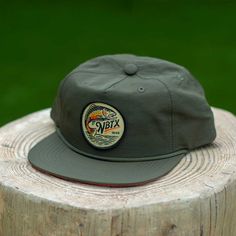 We’re showing our love for New Braunfels' German heritage with this vintage-inspired NBTX German Trout fishing snapback rope cap in German Flag colors. This muted beauty features a medium crown height, durable nylon lightweight, perforated, breathable fabric, a snapback closure, and a pliable bill for a customized fit. Tubing the river? This snapback is made from 100% durable nylon! River Road is a clothing and apparel designer based in Texas. Shirts, hats, souvenirs, and gifts are what we live Fishing Grandpa, Texas Hat, Visual Clothing, New Braunfels Texas, German Heritage, German Flag, Texas Shirts, Beauty Features, River Road