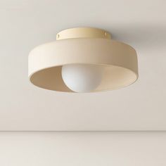 a white light hanging from the ceiling in a room with no one on it or someone else