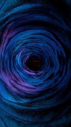 the inside of a blue and purple swirl