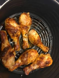 chicken wings cooking in an air fryer