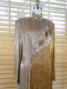 "This is a GORGEOUS hand beaded gown with exquisite detailing! Label - Bob Mackie Boutique It's in PERFECT condition with the original tags attached Bust - 38\" Waist - 32\" Hips - 40\" Shoulders - 17\" Sleeves - 24\" Length - 59\" Tag Size - 10 This dress comes from a pet-free and smoke-free home. If you would like more info or have any questions, please don't hesitate to ask!" Fitted Contrast Sequin Cocktail Gown, Glamorous Fitted Beaded Gown, Fitted Sequin Festive Gown, Festive Fitted Sequin Gown, Vintage Sequin Evening Dress, Glamorous Fitted Hand-embellished Sequin Dress, Vintage Sequin Evening Gown, Vintage Sequin Gown For Evening, Vintage Sequin Gown For Formal Occasions