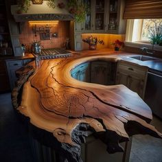 a wooden counter top in the middle of a kitchen