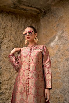 Obaid Sheikh Exclusive CollectionA structured, Mughal-inspired, pure atlas sherwani in a spice red color. Paired with a khadi silk dupatta and hand-embroidered brooch detail. All in all, a truly regal look. Festive Silk Traditional Wear With Naqshi, Elegant Red Unstitched Suit With Dabka, Elegant Brocade Kurta With Zari Work, Elegant Red Kurta With Naqshi Detailing, Red Raw Silk Traditional Wear With Naqshi, Elegant Red Kurta With Naqshi, Elegant Traditional Wear With Dabka On Jamawar, Festive Anarkali Sherwani With Dabka Work, Anarkali Brocade Traditional Wear With Dabka