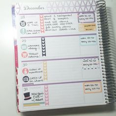 an open planner book with stickers on it