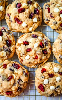 cookies with cranberries and white chocolate chips on a cooling rack, ready to be eaten