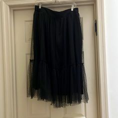 Black With Sheer Layer On Top. Great For Over Leggings Or Dressing Up With A Blazer. Size M Black Tulle Bottoms For Night Out, Black Tiered Tulle Skirt, Chic Black Bottoms With Tulle Skirt, Casual Lined Skirt Bottoms For Evening, Black Skirt With Elastic Waistband For Evening, Black Tiered Skirt For Spring, Orange Midi Skirt, Blue Striped Skirt, Crinkle Skirt