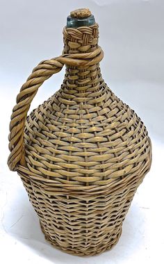 an empty wicker bottle is shown on a white background