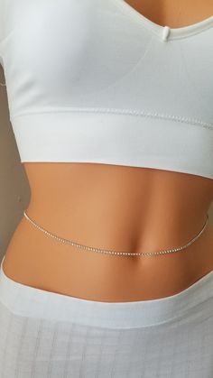 Rhinestones Belly Chain, Rhinestone Belt, Belly Chain, Gold Belly Chain, Silver Belly Chain Cast a dazzling glow over your natural curves with this amazing piece of jewelry. ★Details: ~Silver rhinestones chain  ~The chain is secured at the back with a clasp. ~ 2 inches adjustment chain in addition to the size you want. ~Comes elegantly in a cute package, ready for gift giving. ★How to order: ~Please choose your waist size on top right of the page for perfect fit. ~Size: I need your exact waist s Silver Crystal Waist Chain For Party, Silver Belly Chain, Gold Crystal Body Chain With Rhinestones, Elegant Silver Crystal Waist Chain, Gold Crystal Body Jewelry With Bling, Dainty Silver Adjustable Waist Chain, Dainty Crystal Jewelry With Rhinestones, Crystal Body Jewelry With Bling For Gift, Crystal Bling Body Jewelry As Gift