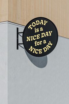 a sign on the side of a building that says today is a nice day for a nice day