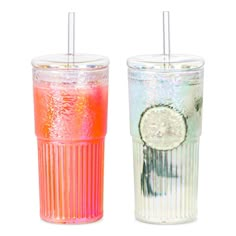 two different colored drinks with straws in them