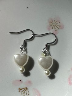 ♡ Trendy heart earrings handmade with faux pearls and linked with stainless steel wire. ♡ Tarnish free and made to last (with proper care). ♡ Choose between the 3 heart style or 1 heart style. ♡ Silver stainless steel and gold plated stainless steel options available. Stainless Steel Wire, Heart Earrings, Earrings Handmade, Faux Pearl, Silver Earrings, Gold Plate, Plating, Stainless Steel, Silver