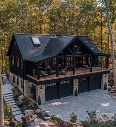 an aerial view of a house in the woods