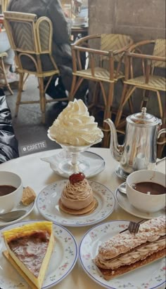 desserts and coffee are sitting on the table