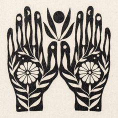 two black and white hands with flowers on them