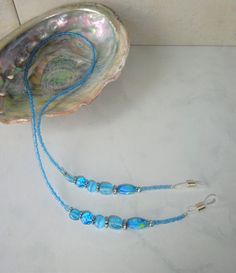 "Uniquely Created eyeglass holder using various shaped sky blue glass beads with silver toned spacers finished with light blue seed beads.  The chain is 26\" long and should fit most eyeglasses or sunglasses." Glasses Chains, Red Glasses, Cute Glasses, Eyeglass Holder, Eyeglass Chain, Glasses Chain, Eye Wear Glasses, Turquoise Jewelry, Blue Pattern