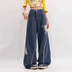 Model wearing the blue Distressed Star Patch Flare Jeans Japanese Trousers, Flare Jeans Y2k, Streetwear Japanese, Wide Leg Denim Pants, Retro Hip Hop, Black Party Dresses, Jeans Y2k, Cardigan Sweater Jacket, Hip Hop Streetwear