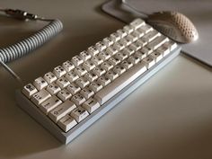 a computer keyboard sitting on top of a table