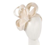 Handmade ivory cream loops of pure abaca fabric placed on the headband. Hand-made in the heart of Melbourne by our experienced milliners, this elegant racing fascinator will put finishing touches on your spring racing outfit.  Made in Australia  Eco-friendly abaca fabric  Comfortable headband Elegant Cream Headband For Spring, Spring Cream Mini Hat Headband, Chic Kentucky Derby Headband Fascinator, Elegant Beige Headpieces For Spring, Chic White Headband, Elegant Summer Event Hair Accessories, Chic Fascinator Headband For Events, Chic Headband Fascinator For Events, Beige Headpiece For Kentucky Derby Event