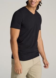 About Our Men's Tall V-Neck T-Shirts Every guy needs a basic tall t-shirt in his wardrobe. It's the quintessential base layer that you can wear throughout all the seasons. But as a tall guy, finding tees that fit your frame can be a struggle, with lengths that end awkwardly at the waist and sleeves that are just a little bit too short. That's where we come in. We set out to design the ultimate staple tee that you can wear with anything and everything, in a style crafted exclusively for tall men Black V-neck Moisture-wicking T-shirt, Solid V-neck T-shirt With Moisture-wicking, Solid Moisture-wicking V-neck T-shirt, Black V-neck T-shirt With Moisture-wicking, Black Moisture-wicking V-neck T-shirt, Classic Black Moisture-wicking Top, Black V-neck Top With Moisture-wicking, Tall Men, Men In Black