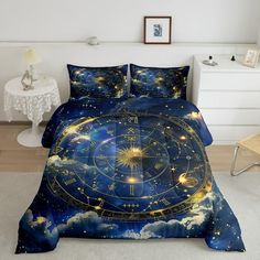 a bed covered in a blue comforter with a clock and stars on the sky