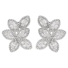 Stunning illusion set diamond cluster earrings diamonds, by Alexander Beverly Hills. 288 round brilliant, marques, and princess cut diamonds, 5.53 carats total. Approximately G/H color and VS2/SI1 clarity. 10.76 grams, 18-karat white gold, 1.25 inches long. Accommodated with an up-to-date appraisal by a GIA G.G. once purchased, upon request. Please contact us with any questions. Item Number E4008 Sparkling Diamond White Cluster Earrings, Sparkling Diamond Cluster Earrings In Diamond White, Diamond White Sparkling Cluster Earrings, Luxury Marquise Cut Diamond Cluster Earrings, White Diamond Cluster Earrings Marquise Shaped, Diamond White Cluster Diamond Bridal Earrings, Diamond White Cluster Bridal Earrings, Earrings Diamonds, Diamond Cluster Earrings