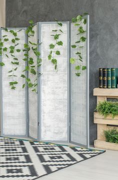 a room divider with plants growing on it