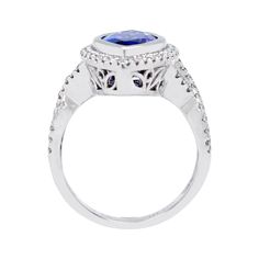 A combination of striking colors and styles that are hard to miss, the spectacular finish of this magical ring enhances your ensemble by leaps and bounds. Featuring a stunning Tanzanite in a marquise cut, it flaunts round diamonds that surround the mesmerizing shade of the jewel, giving it an unblemished look. Crafted in 14K white gold, this is a one-of-a-kind luminous ring! Product Information SKU ADG913258/1 Metal Type 14K Metal Color White Gold Ring Style Halo Primary Stone Gemstone Name Tanz Exquisite Tanzanite Round Cut Rings, Luxury Trillion Cut Ring With Accent Stones, Trillion Cut Platinum Gemstone Rings, Fine Jewelry Multi-stone Trillion Cut Ring, Dazzling Tanzanite Ring With Halo Setting, Dazzling Tanzanite Brilliant Cut Ring, Elegant Tanzanite Ring With Halo Setting, Fine Jewelry Halo Ring With Gemstone In Round Cut, Formal Fusion Rings With Accent Stones