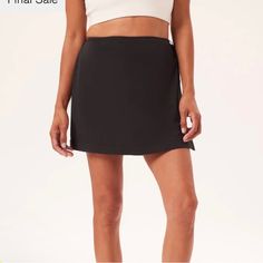 Nwt Made From Stretch Woven Materials: 86% Recycled Plastic Bottles (Rpet) And 14% Spandex Water-Resistant Designed To Fit Easy And Relaxed With An Adjustable Wrap And Tie Under Short And Elastic Waistband Visible From The Back 13.5” Long Trendy Short Stretch Tennis Skirt, Trendy Black Stretch Skort, Trendy Black Stretch Tennis Skirt, Black Casual Short Leg Skort, Trendy Stretch Skort With Built-in Shorts, Black Mini Skort For Athleisure, Black 4-way Stretch Tennis Skirt For Summer, Trendy Stretch Short Skort, Solid Mini Length Sports Bottoms